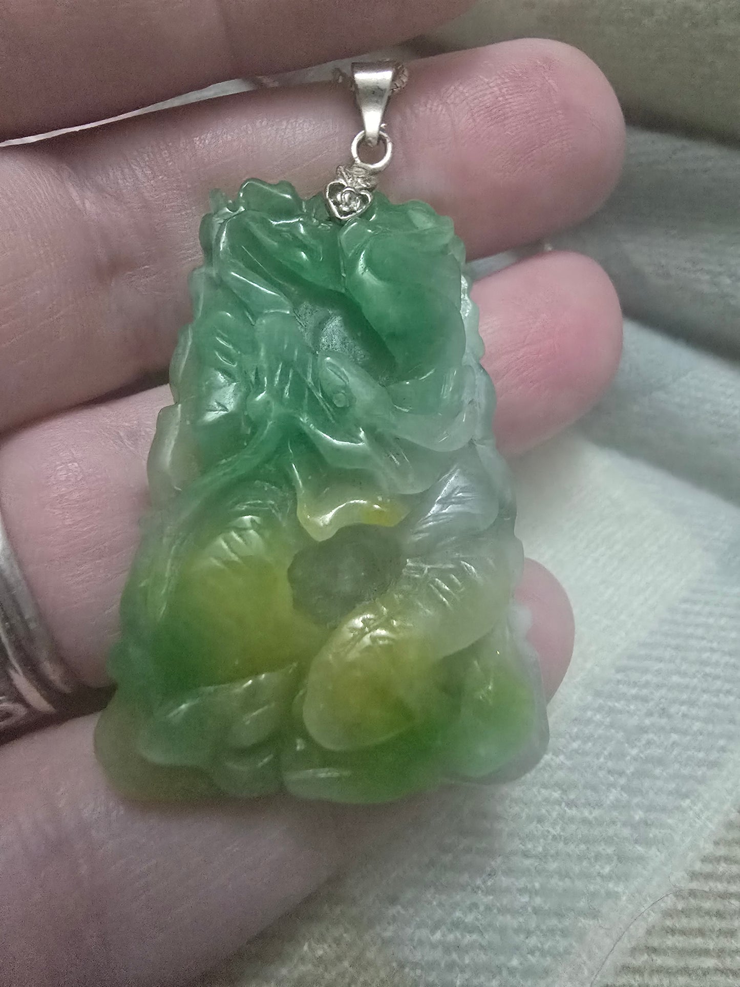 Apple Green and yellow jade Chinese year pendant. Fire horse and snake, very well carved.