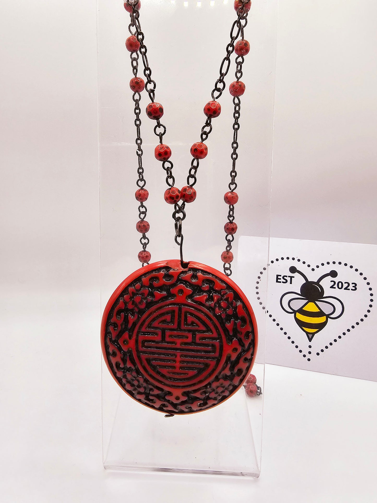 Modern copy of vintage cinnabar pendant