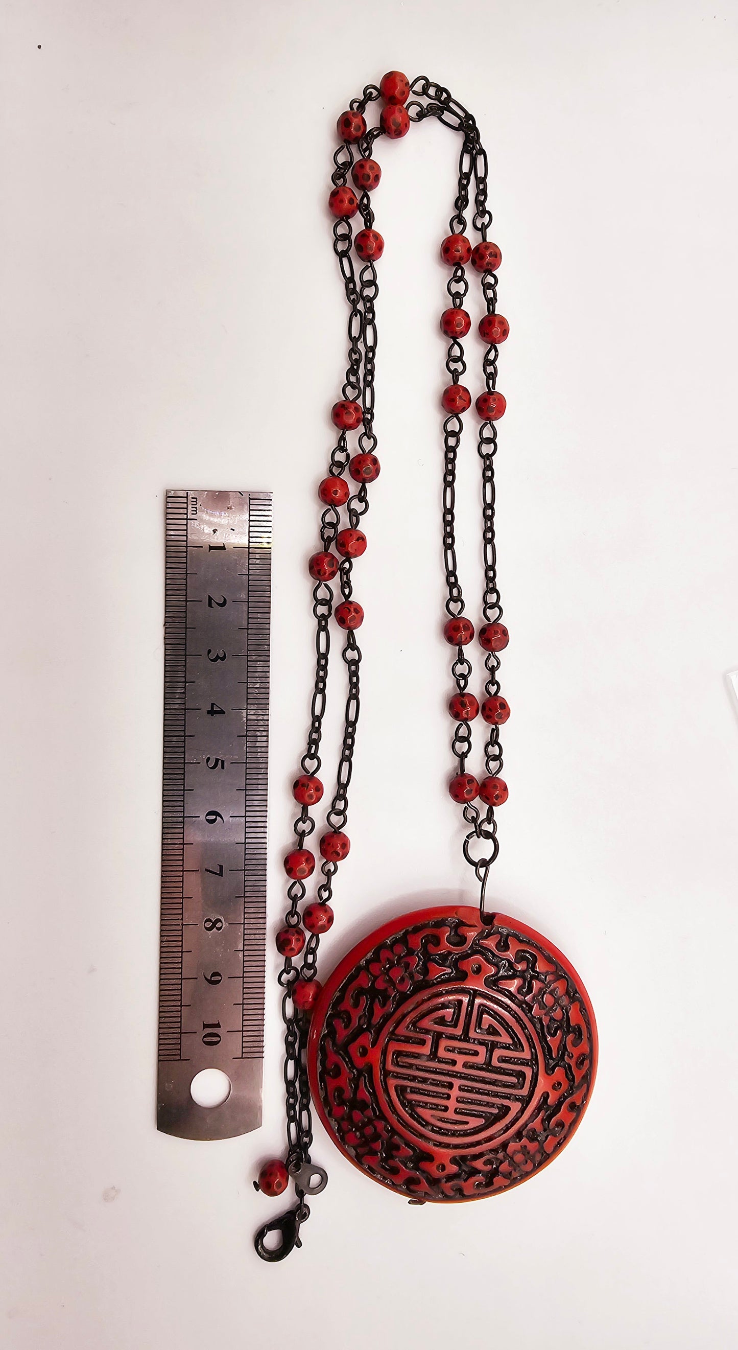 Modern copy of vintage cinnabar pendant