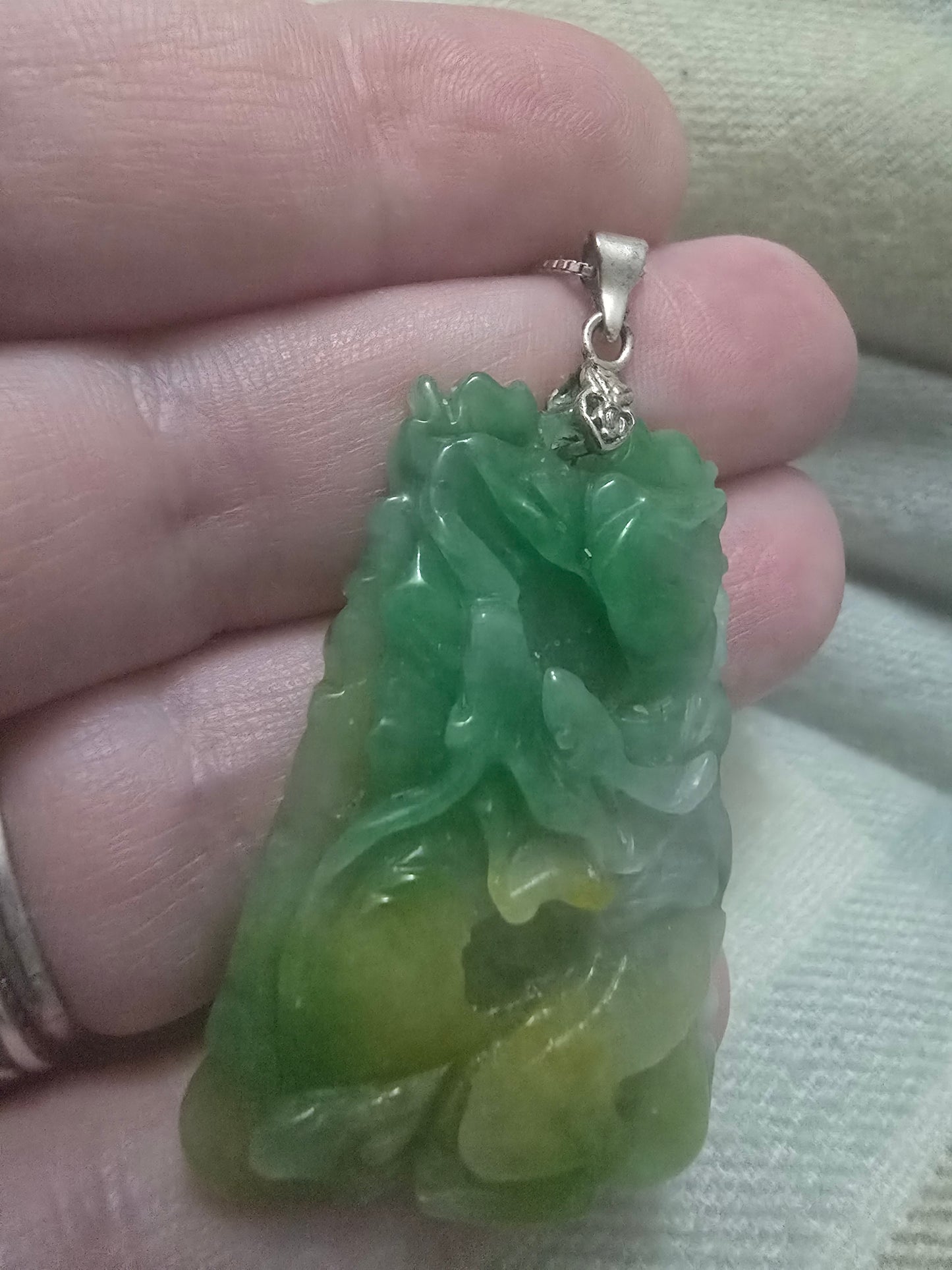 Apple Green and yellow jade Chinese year pendant. Fire horse and snake, very well carved.