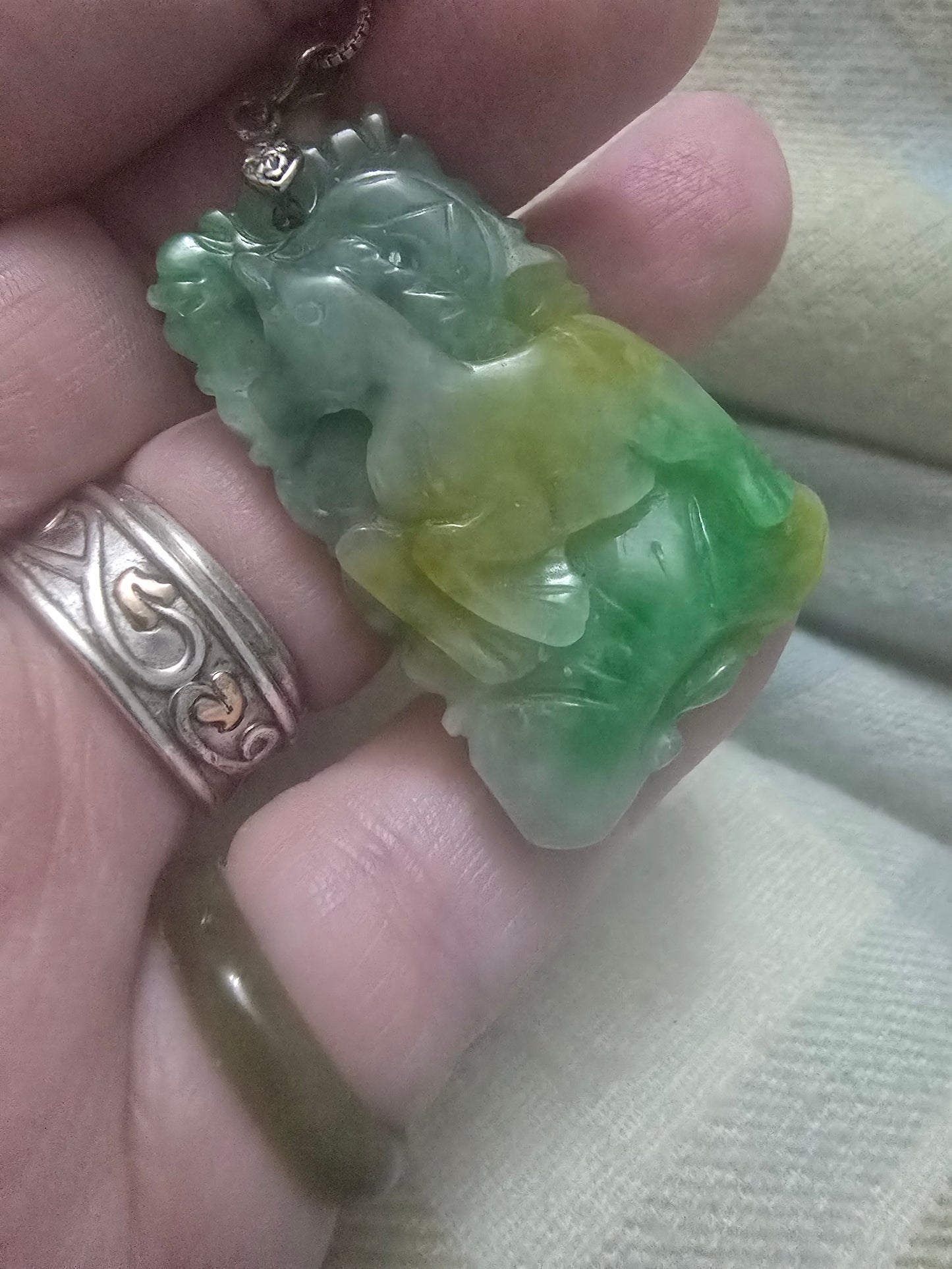 Apple Green and yellow jade Chinese year pendant. Fire horse and snake, very well carved.